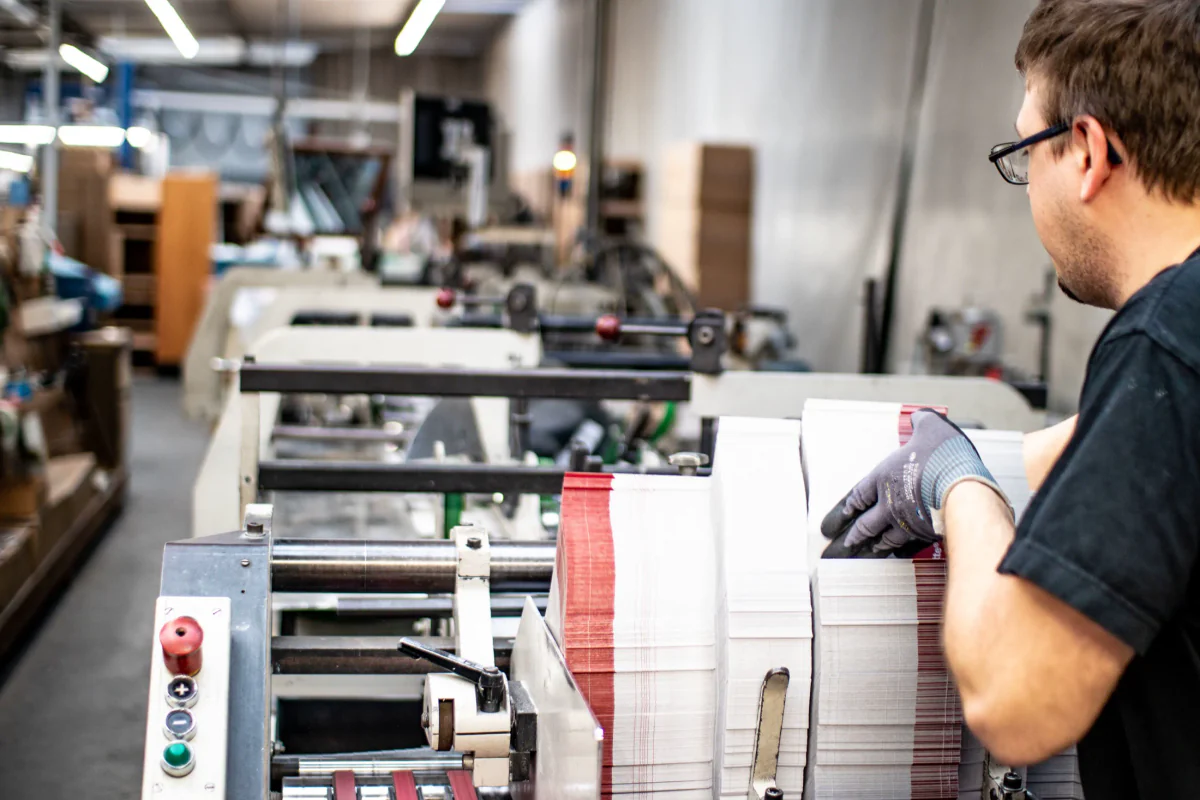 Employee converting printed board blanks at the HvC plant